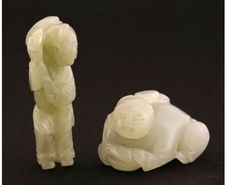 A Chinese jade boy,Qing dynasty (1644-1911), standing carrying a lingzhi stem over his shoulder,5.5cm, andanother,lying on hi