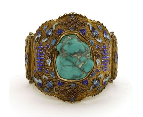 A Chinese silver gilt hinged bracelet,1930s, the mesh ground decorated with knots, bats and shou surrounded with clouds in cl