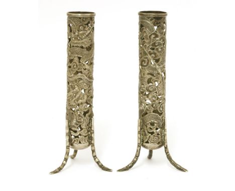 A pair of Chinese silver spill vases,c.1900, by Wang Hing, of cylindrical form, pierced and cast with two dragons amongst clo