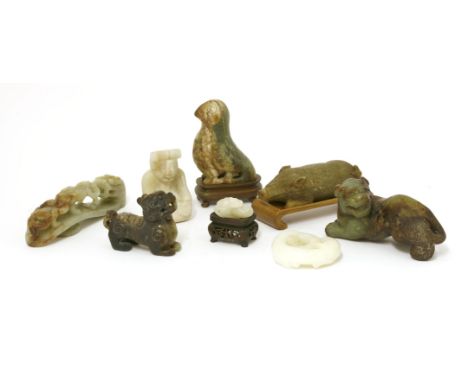 A collection of Chinese jades, 20th century, comprising: a belt hook carved with a dragon with chilong, 12cm long, a white ja