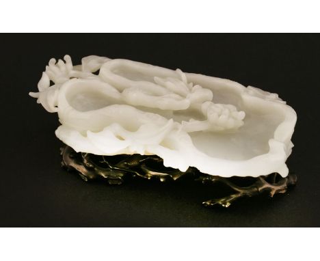A Chinese jade brush washer, 18th/19th century, carved as a tree trunk surrounded by finger citron branches and a butterfly, 
