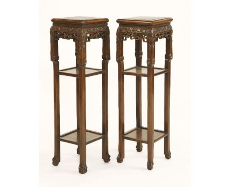 A pair of Chinese black wood hongmu square pedestal tables,c.1850-1900, each top inset with mottled red and white marble, the