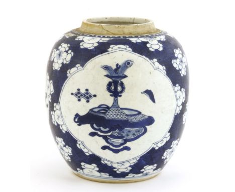 A Chinese blue and white ginger jar, Kangxi (1662-1722), painted with precious objects in shaped panels against prunus on a c