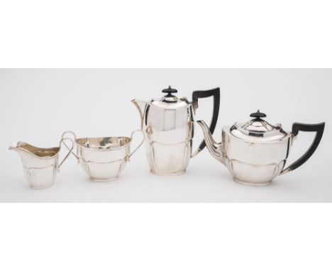 A George V silver four-piece tea service, maker Emile Viner, Sheffield, 1932/34: of plain slender oval form, with moulded rim