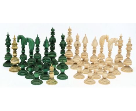 A 19th century Indian 'Pepys' type ivory chess set: one side stained green, the other side left natural, the pieces with elab