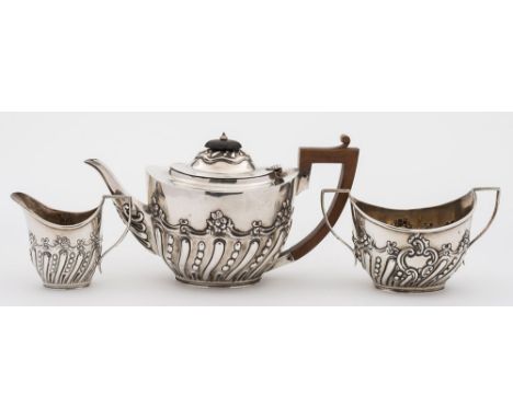 A Victorian silver three-piece tea service, maker William Gigson & John Langham, London, 1896/97: of oval form with writhen f