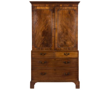 A George III mahogany linen press:, the upper part with a moulded dentil cornice, fitted with sliding trays enclosed by a pai