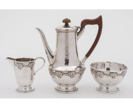 A George V hammered silver three-piece bachelor's coffee service, maker Albert Edward Jones, Birmingham, 1926: banded with gr