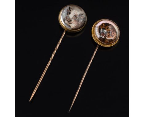 A gold backed, reverse painted crystal intaglio stick pin depicting a tiger and a similar open backed stick pin depicting a b