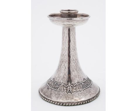 An Art Nouveau period silver candlestick, maker Albert Edward Jones, Birmingham, 1919: the conical stem with circular drip tr