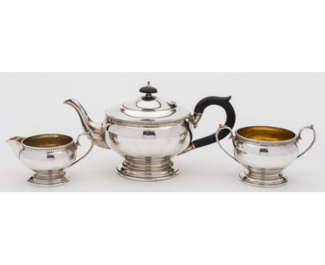 A George VI silver three-piece tea service, maker William Bush & Sons, Sheffield, 1943: of plain circular form with ovolo dec
