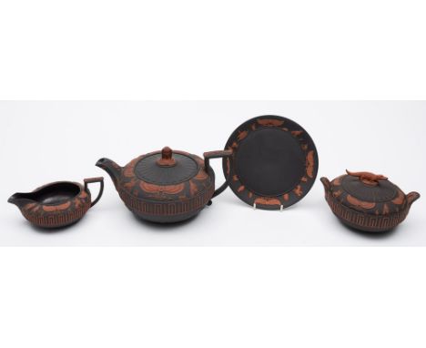 A fine Wedgwood rosso antico 'Egyptian' part tea service: applied in red terracotta on a black basalt ground with sphinx and 