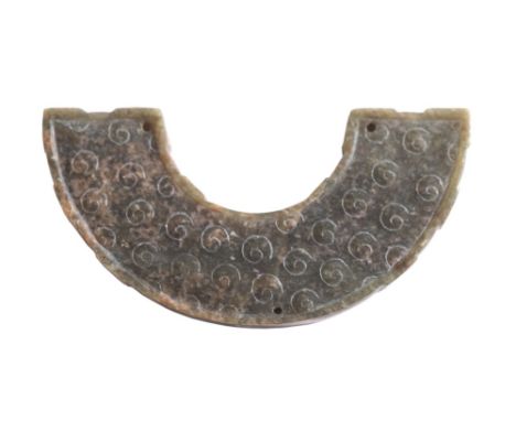 A Chinese jade and hardstone composite necklace:, in the form of a bi half-disc carved with scroll motifs.8.75cm. wide.