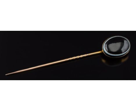 An oval banded agate single stone stick pin: the oval agate 20mm long x 15mm wide with closed back setting, 90mm total length