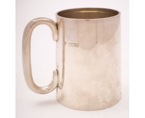 A George V silver mug, maker Haseler Brothers, London, 1912: of plain cylindrical tapering form with C-shaped handle, 10.4cm.
