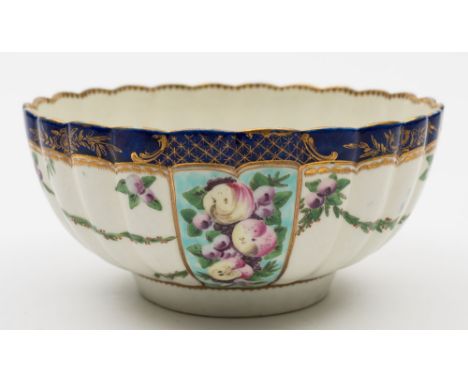 A Worcester fluted slop bowl: painted with alternate panels of spotted fruit on a turquoise ground and swags of berried folia
