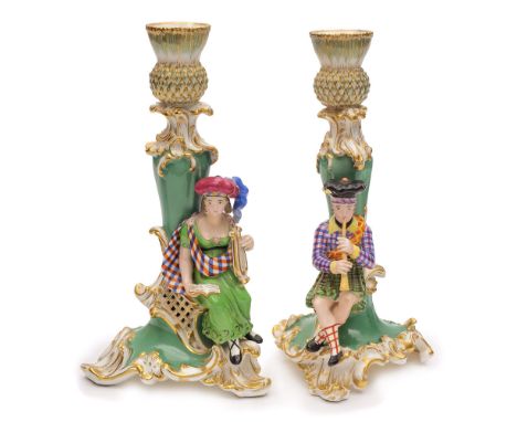 A pair of English porcelain figural candlesticks, probably Minton: modelled with Scottish musicians, he seated in tam-o-shant