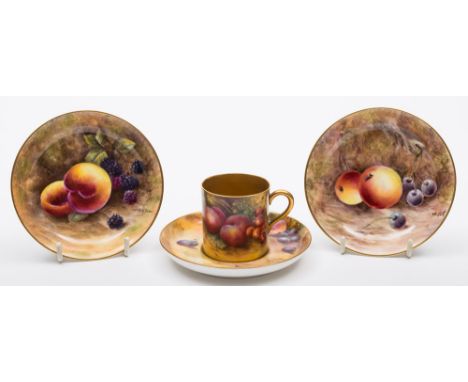 A small group of Royal Worcester fruit painted porcelain: comprising two shallow circular dishes painted with apples, cherrie