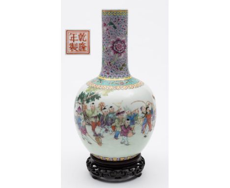 A Chinese porcelain bottle vase: enamelled in the famille rose palette with a procession of children playing instruments, hol