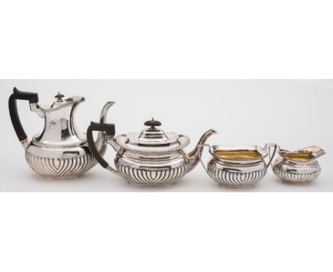 An Edward VII silver four-piece tea and coffee service, maker Walter & Charles Sissons, London, 1901: of barge shaped outline