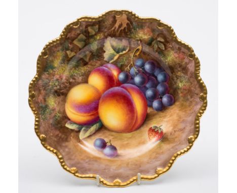 A Royal Worcester porcelain plate: of silver shape painted by Harry Ayrton with peaches, grapes and a strawberry on a mossy g