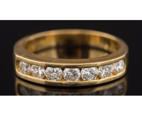 An 18ct yellow gold and diamond seven stone half eternity ring: with circular brilliant-cut diamonds estimated to weigh a tot