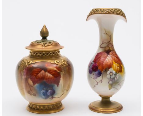 A Royal Worcester porcelain vase and a jar and cover: the former of slender footed form with pierced navette shape rim painte