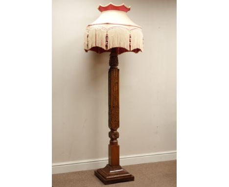 20th century mahogany standard lamp, heavily carved with foliage, on moulded stepped plinth, H188cm (with shade)     Conditio