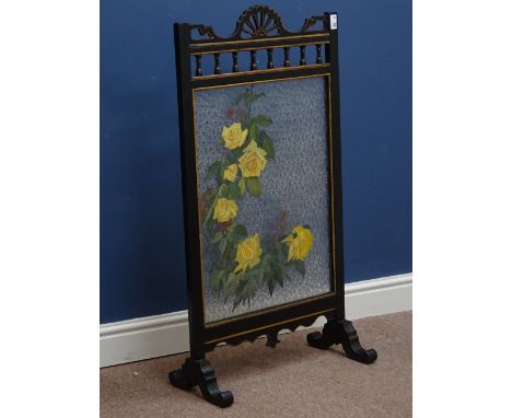Early 20th century black painted and gilt firescreen with mottled glass panel, painted with flowers, W54cm   Condition Report