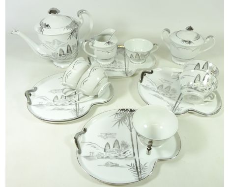 Japanese Kutani China tea service, decorated with landscapes in silver on a white ground, for six persons (15)    Condition R