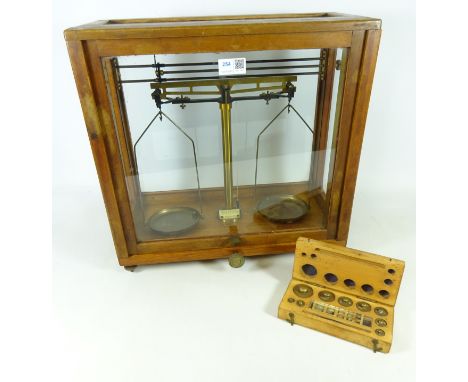 Cased set of Chemical Balance scales and a boxed set of brass metric weights (2)   Condition Report   Click here for further 