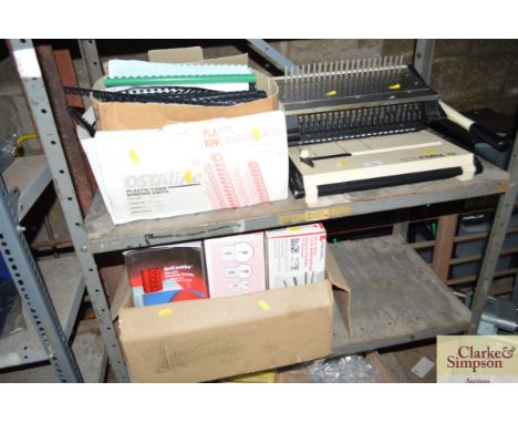 A quantity of ring binders and a binding machine 