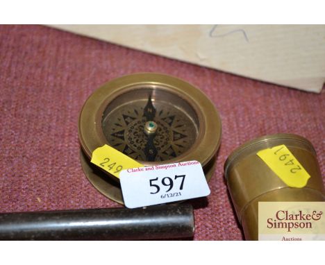 A reproduction brass cased compass