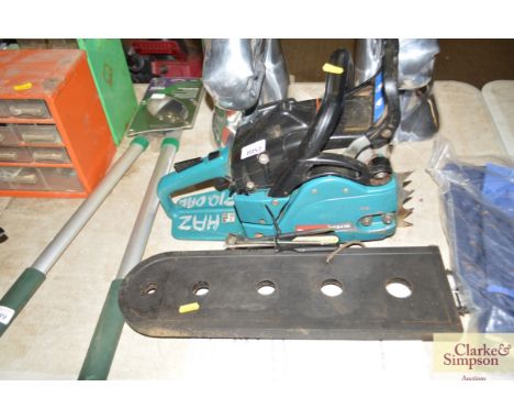 A Makita chain saw with instruction manual 