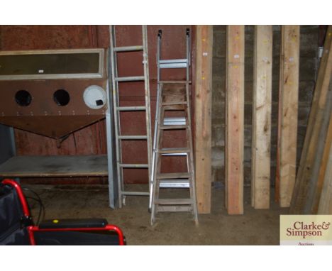 A wooden step ladder and an aluminium step ladder
