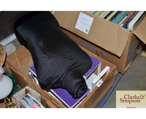 A box containing display stands and a mannequin 