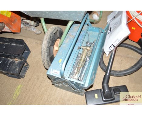 A cantilever tool box with contents