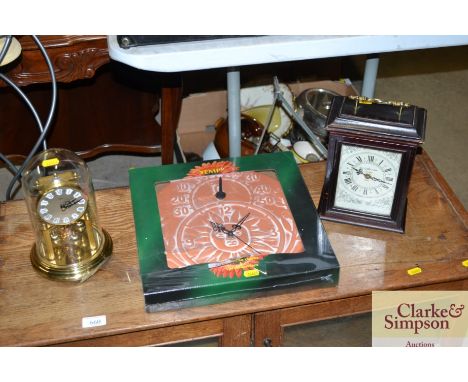 An outdoor terracotta clock and thermometer together with an anniversary clock and a mantel clock