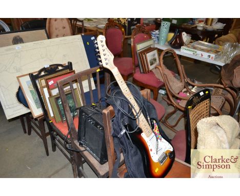 An electric guitar in carrying case and guitar amplifier