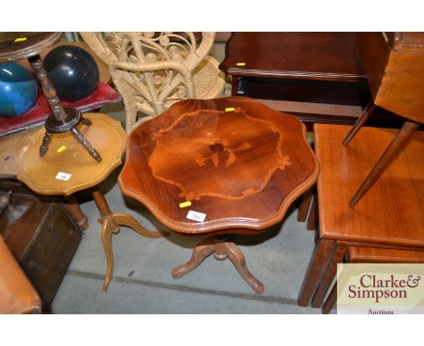 An Italian style side table raised on tripod base 