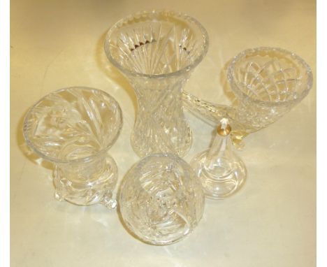 A CUT GLASS CORNUCOPIA SHAPED VASE, A HEAVY FLUTED OVULAR GLASS VASE, A CUT GLASS THISTLE SHAPED VASE, ON THREE FEET, A CUT G