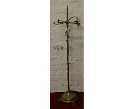 A Victorian brass two branch rise and fall standard lamp (AF).