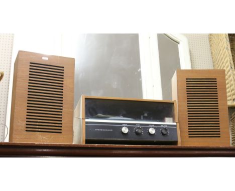 A stereo sound record player with matching speakers.