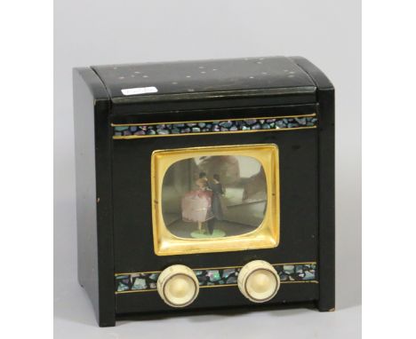 A vintage lacquered novelty jewellery box in the form of a television and inlaid with abalone shell.