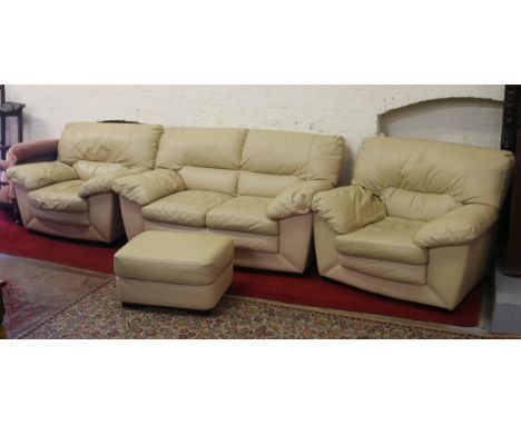 A cream leather four piece suite comprising two seat sofa, two fireside arm chairs and matching pouffe.