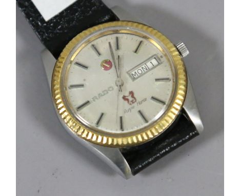 A vintage Rado automatic purple horse stainless steel wristwatch with fluted gilt bezel, centre seconds and having date and d
