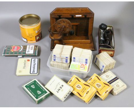 A collection of smoking related items including an oak pipe rack, pipes and a good assortment of cigarette cards etc.