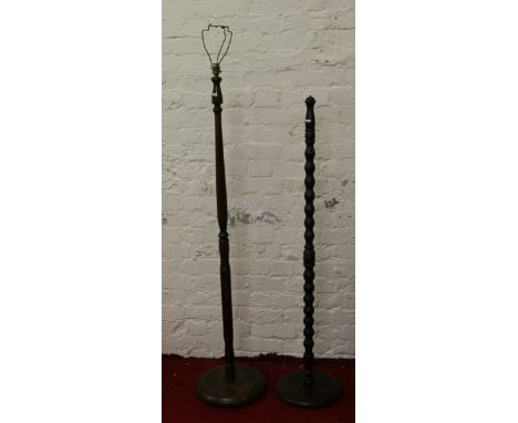 An oak turned standard lamp along with a mahogany standard lamp (AF).