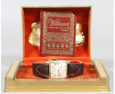 A vintage boxed Longines Wittnauer manual wristwatch in 10ct gold case with tear drop lugs and square dial having Roman numer
