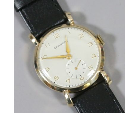 A vintage Garrard 9ct gold manual wristwatch in blue box with tear drop lugs, Arabic numeral markers and subsidiary seconds. 